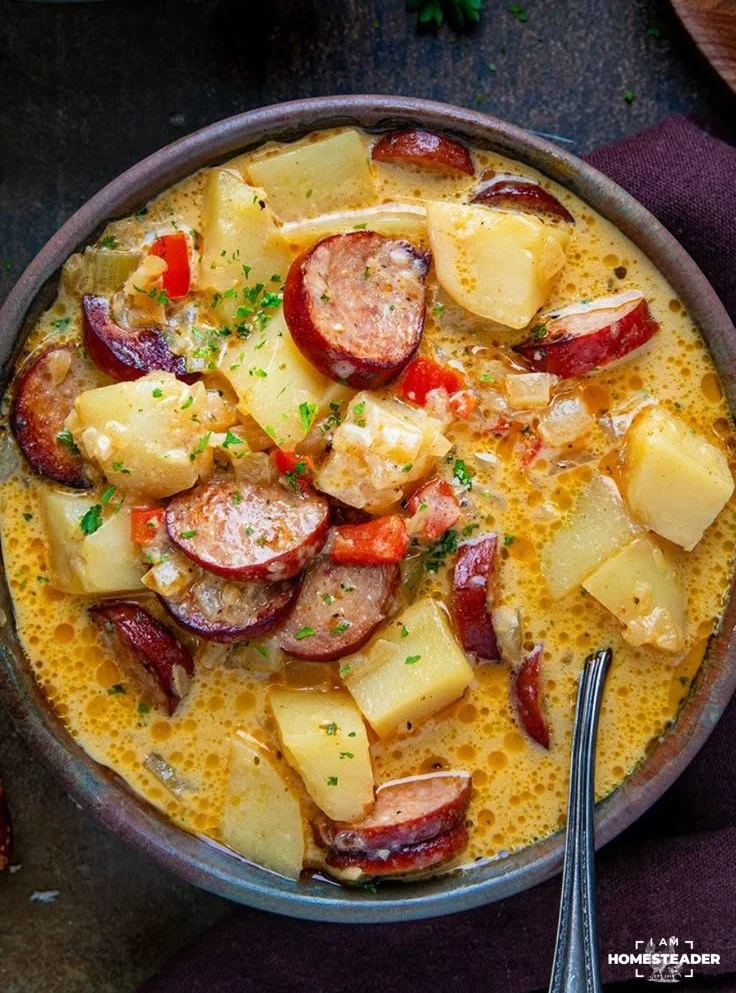Bowl of creamy Cajun Potato Soup garnished with green onions
