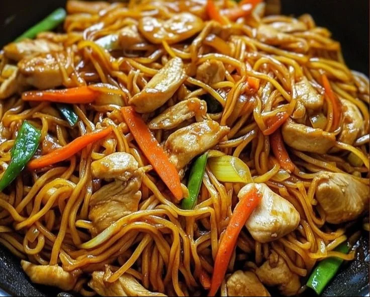 Delicious Chicken Lo Mein served in a bowl with fresh vegetables