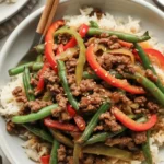 High protein stir fry with chicken and colorful veggies, ready in 30 minutes.