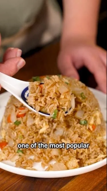 Bowl of easy egg fried rice with vegetables and green onions