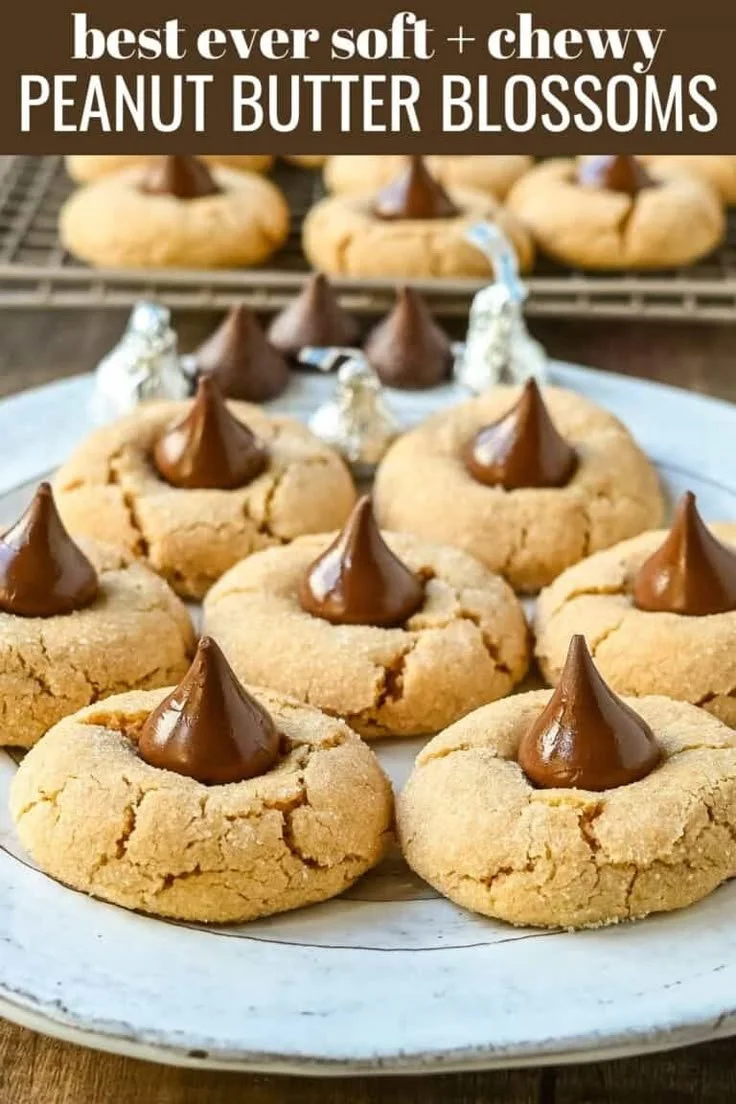 Easy peanut butter blossoms cookies topped with chocolate kisses on a plate.