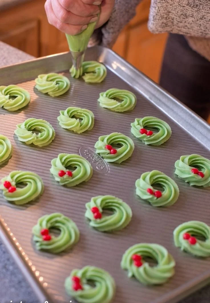 Colorful Wreath Spritz Cookies arranged on a festive platter.