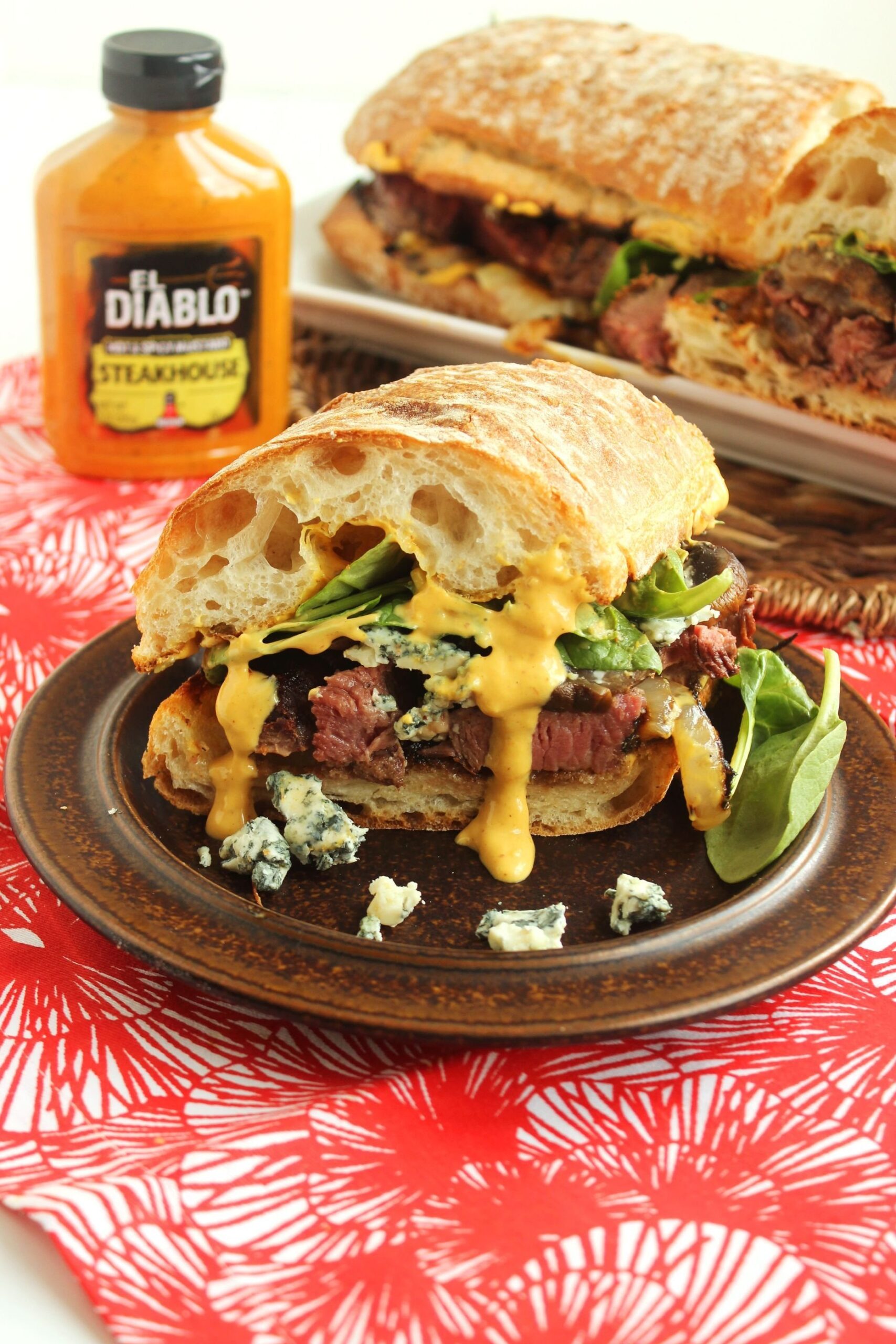 Grilled beef tenderloin sandwich with spicy steakhouse aioli served on a rustic roll.