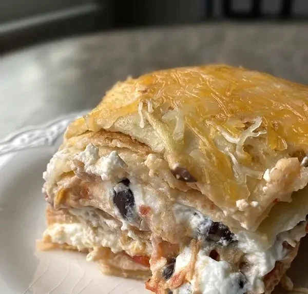 Delicious Chicken Quesadilla Casserole served on a plate with toppings