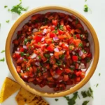 Delicious easy queso dip served in a bowl with tortilla chips
