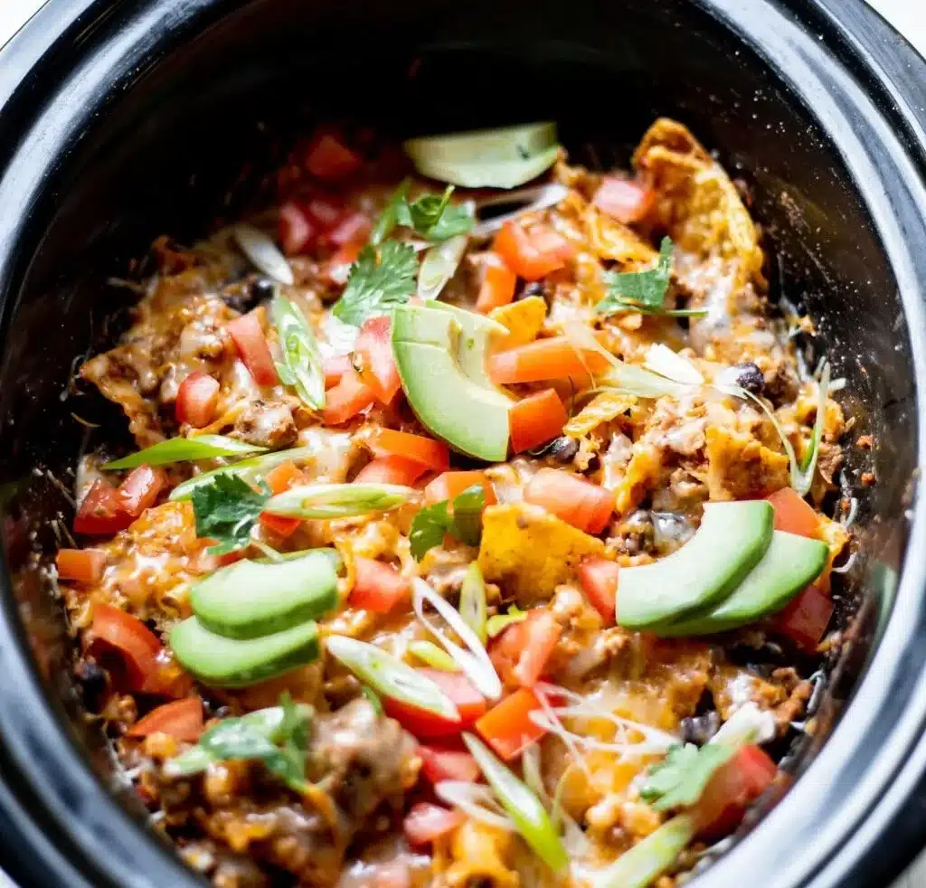Crock Pot Taco Casserole served in a bowl with toppings