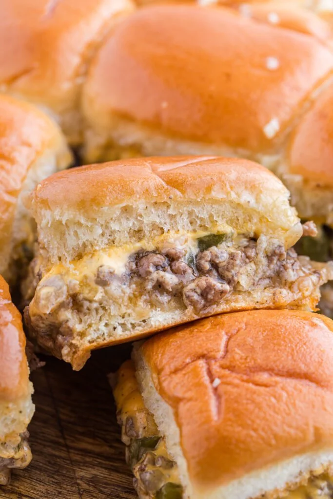 Ground Beef Philly Cheesesteak Sliders served on a platter with toppings