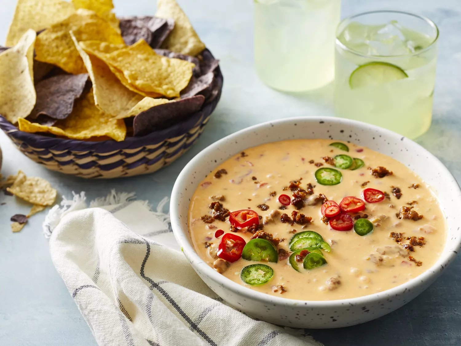 Chorizo Cheese Dip served with tortilla chips in a bowl