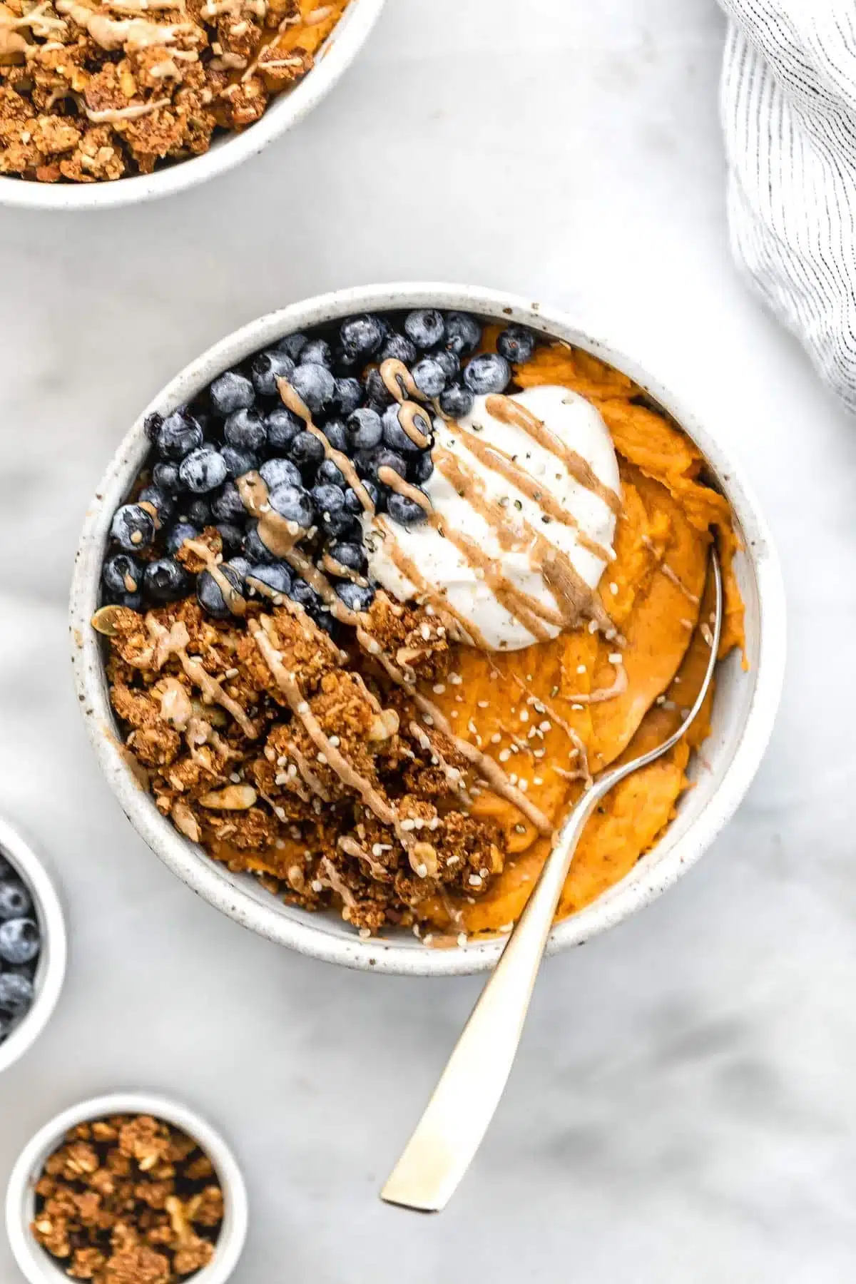 Paleo sweet potato breakfast bowl topped with fresh ingredients