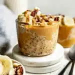 Bowl of Peanut Butter Banana Overnight Oats topped with banana slices and peanut butter