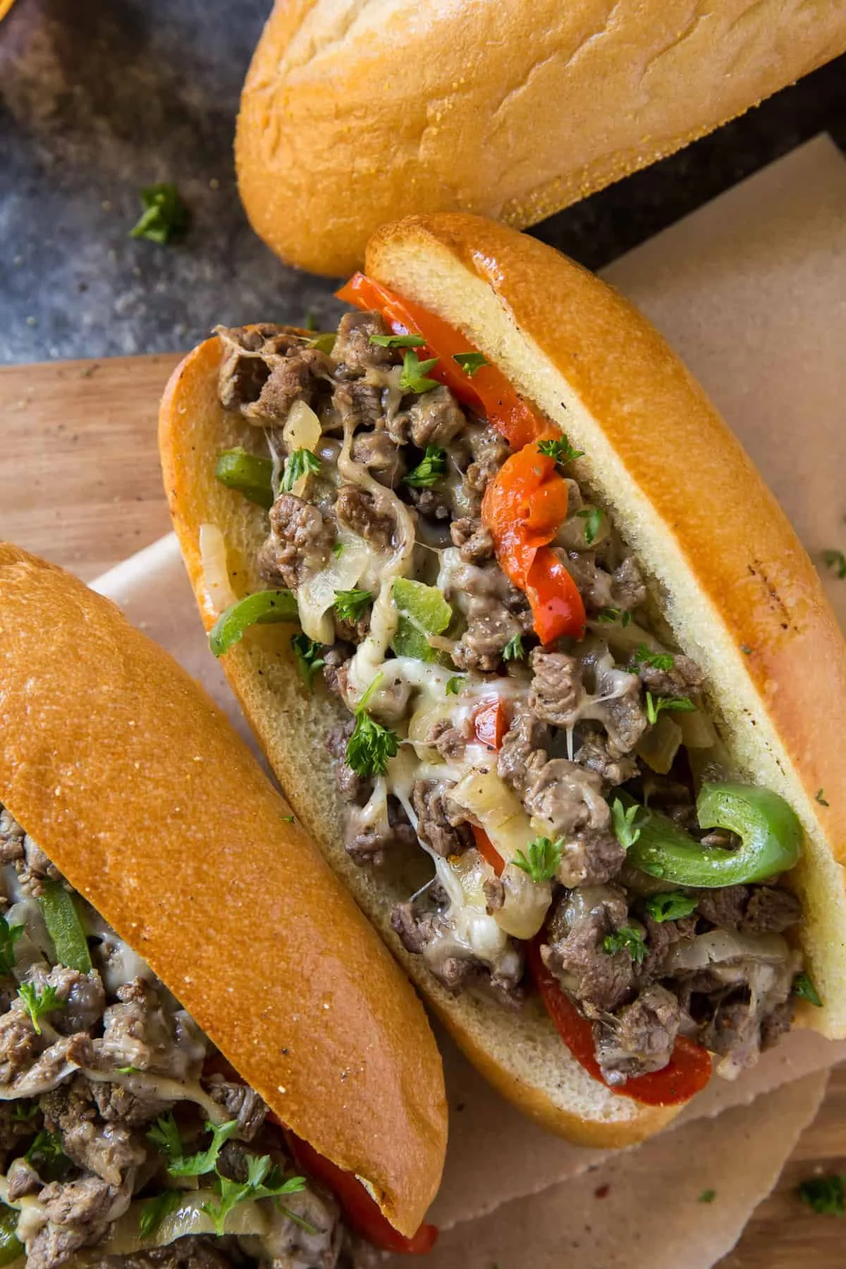 Delicious Philly Cheesesteak topped with fresh peppers and onions