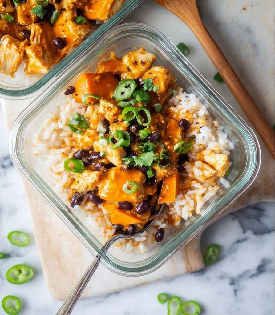 Buffalo chicken rice bowls served with fresh vegetables and sauce