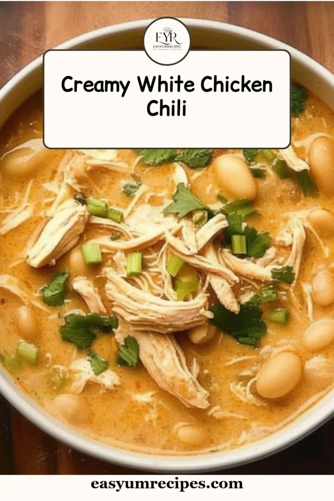 Bowl of creamy white chicken chili garnished with cilantro and served with tortilla chips.