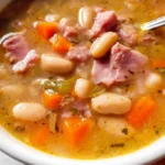 Bowl of easy homemade ham and bean soup with vegetables