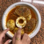 Egg and onion boil dish ready to serve with vibrant colors and rich flavors.