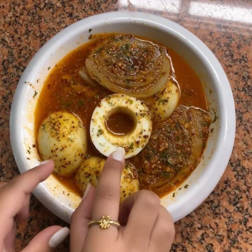 Egg and onion boil dish ready to serve with vibrant colors and rich flavors.