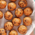 Assorted energy balls made from nuts, seeds, and dried fruits for a healthy snack.