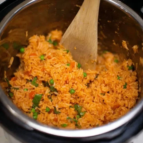 Bowl of authentic Instant Pot Mexican rice with vibrant colors and herbs.
