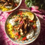 Mediterranean Chicken Rice Bowl with fresh vegetables and herbs