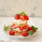 Delicious old fashioned strawberry shortcake topped with fresh strawberries and whipped cream