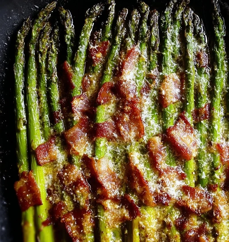 Delicious roasted parmesan asparagus topped with crispy bacon.