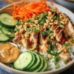 Thai Peanut Chicken Buddha Bowl with colorful vegetables and rice