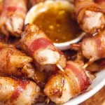 Delicious bacon wrapped chicken bites on a platter