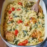 Delicious Chicken Orzo Bake served in a bowl with herbs