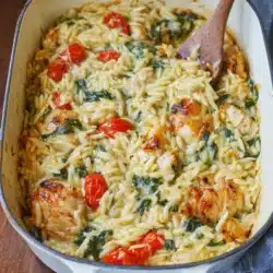 Delicious Chicken Orzo Bake served in a bowl with herbs