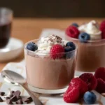 Delicious cottage cheese chocolate mousse served in a bowl with a spoon.