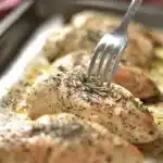 Juicy and flavorful easy baked chicken breasts on a plate