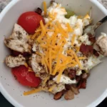 Colorful healthy breakfast bowl with fruits, nuts, and grains