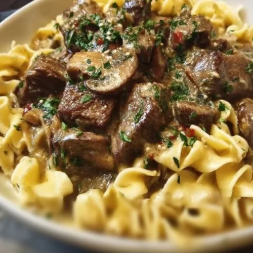 Instant Pot Beef Stroganoff served in a bowl with mushrooms and noodles