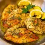 Lemon Pepper Chicken served with roasted zucchini and squash on a plate.