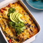 Delicious stuffed poblano casserole topped with cheese and fresh herbs.