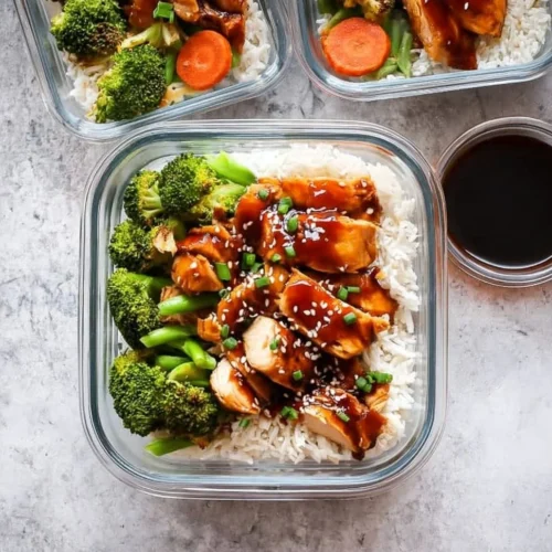 Healthy teriyaki chicken meal prep bowls with vegetables and rice