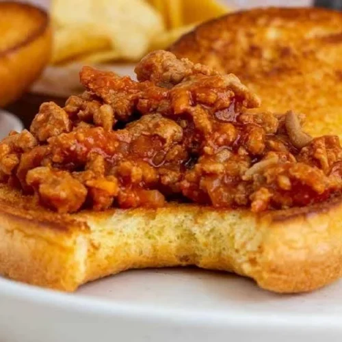 Delicious homemade Turkey Sloppy Joes served on a bun with toppings